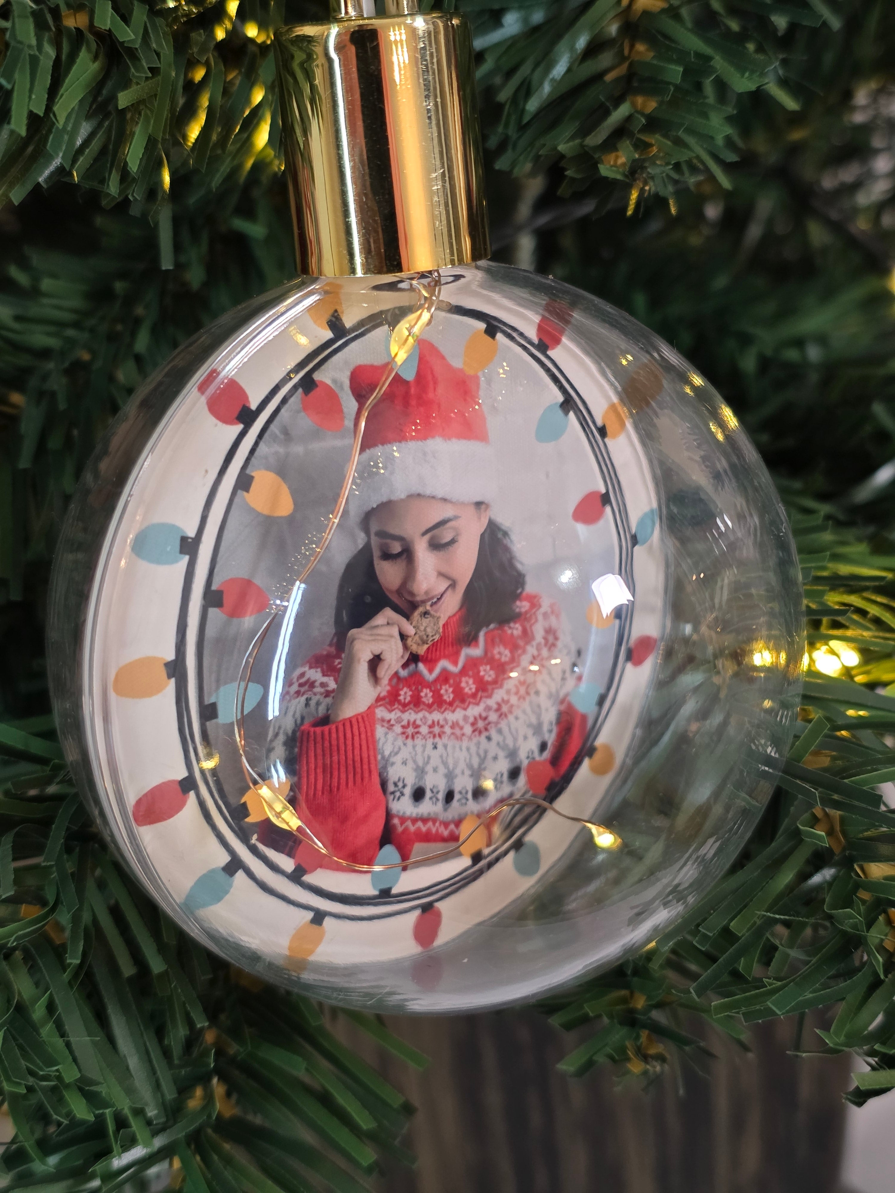 Plastic bauble glowing with warm light