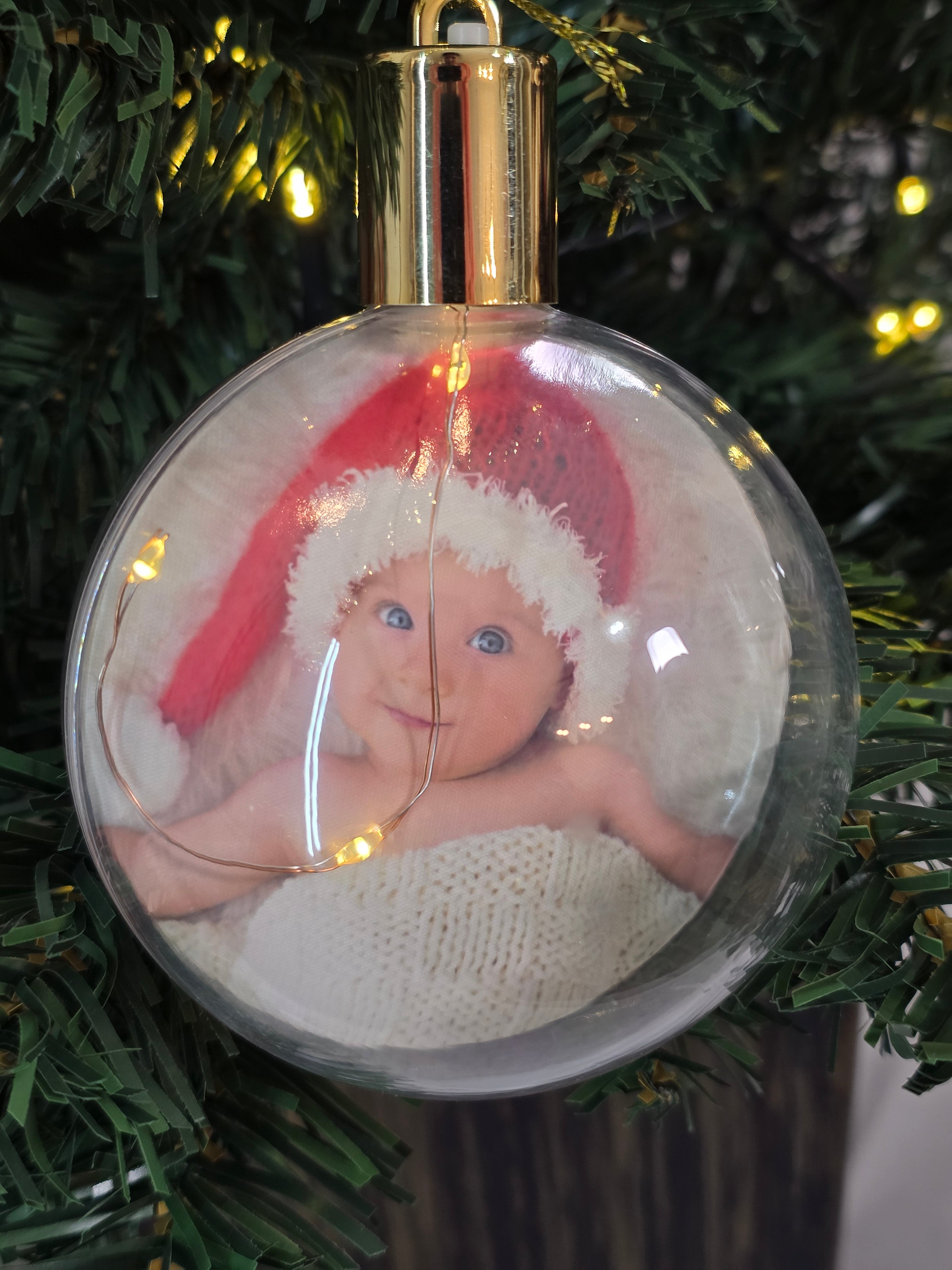 Plastic bauble glowing with warm light