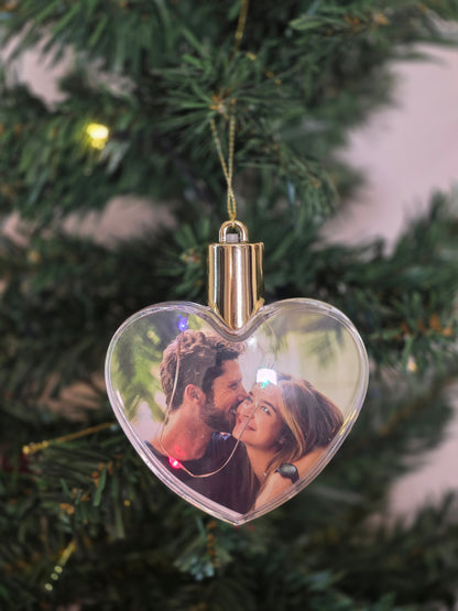 Plastic bauble glowing with colored light - heart