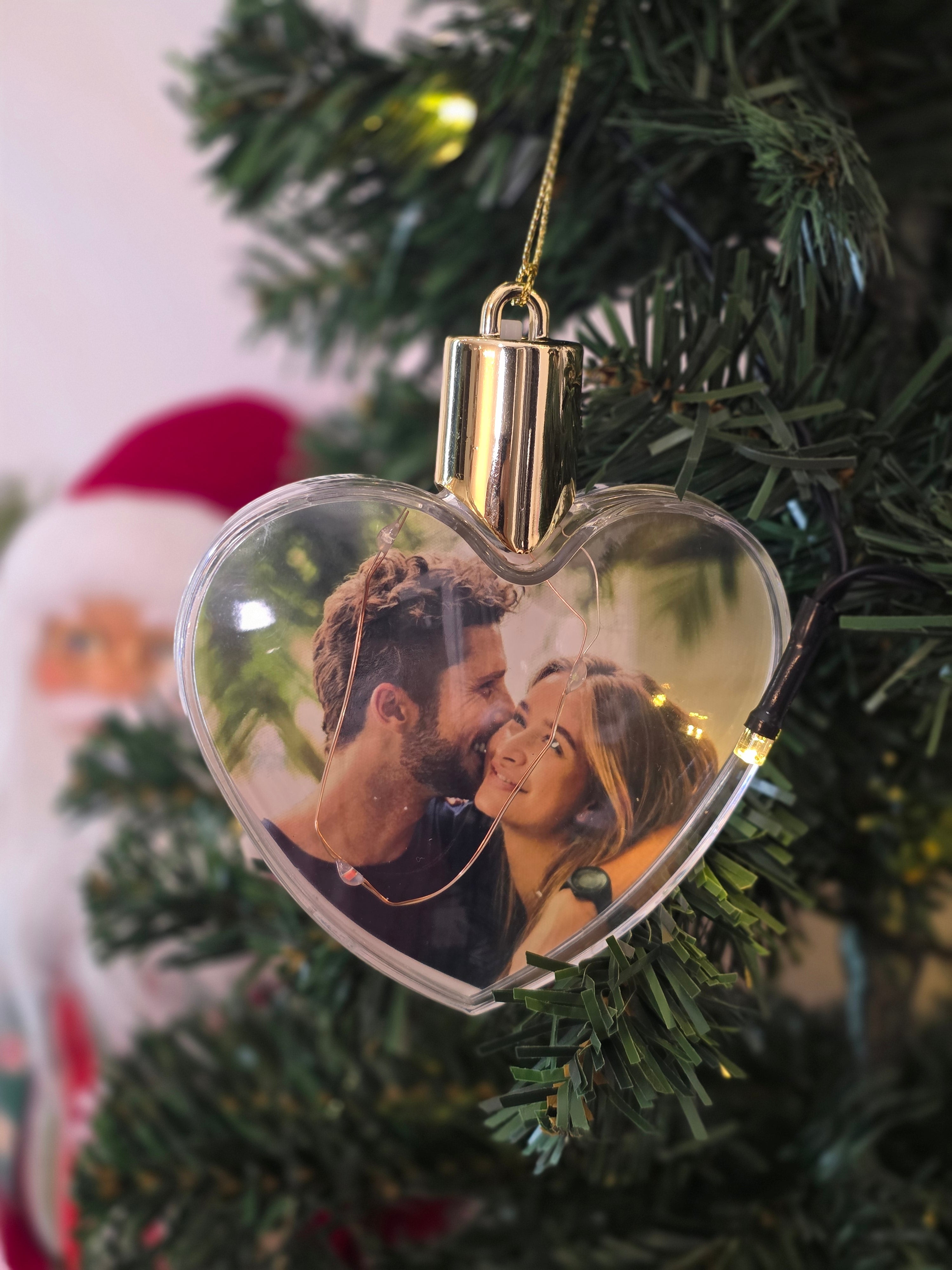 Plastic bauble glowing with colored light - heart