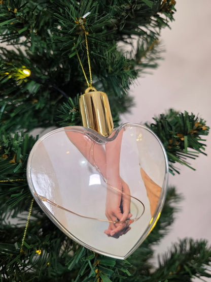 Plastic bauble glowing with colored light - heart