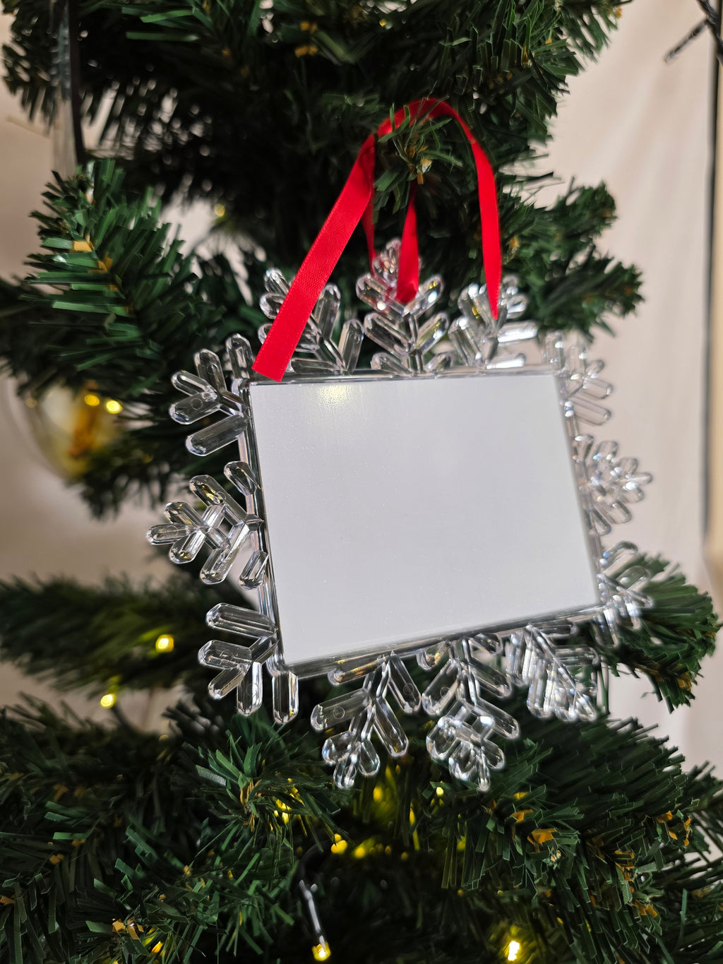 Snowflake ornament with rectangular picture inside